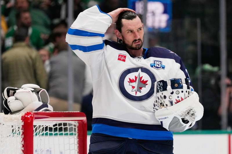Hellebuyck traded to Devils in four‑player, two‑pick deal