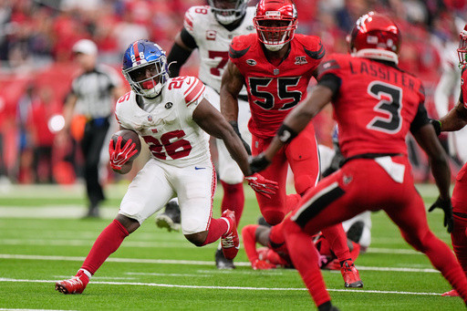 Giants Defeat Texans 27-21 in Overtime as Singletary Scores Winning Run